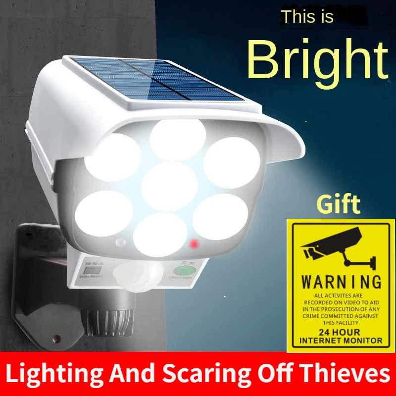 Outdoor Lighting Experts - 屋外ソーラーライトモーションセンサーセキュリティダミーカメラワイヤレスフラッドライトIP65防水77 LEDランプ3モード家庭菜園用